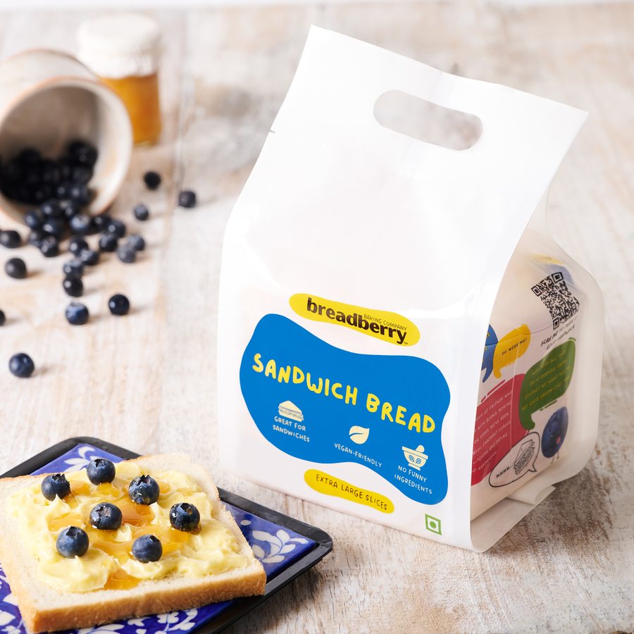 Whipped butter, honey and blueberries on Sandwich Bread